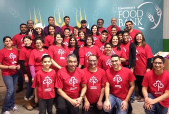 Ismaili Civic150 team packs food for Edmonton's Food Bank